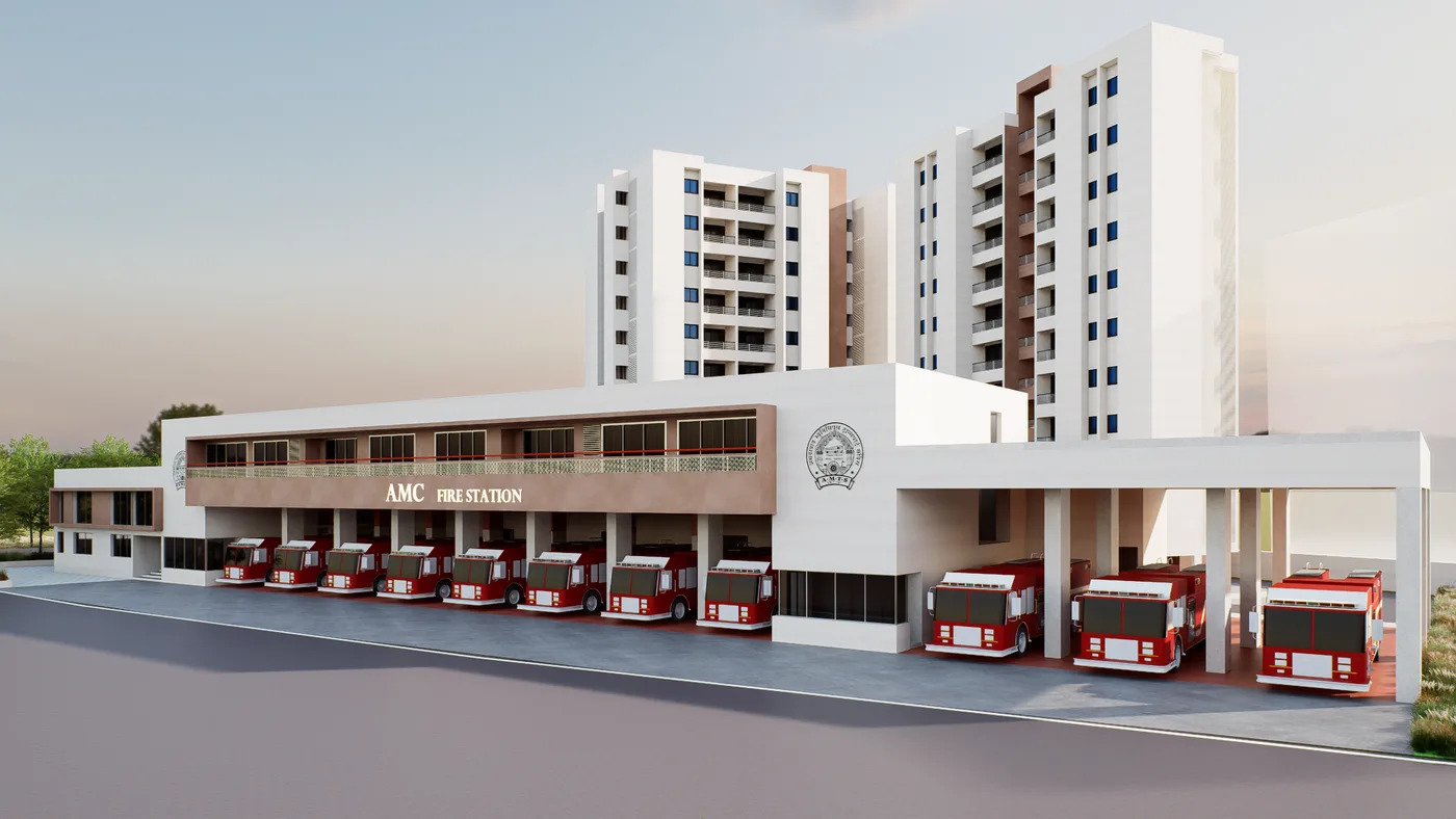 AMC Fire Station at Ranip with fire trucks parked beneath the residential towers behind it