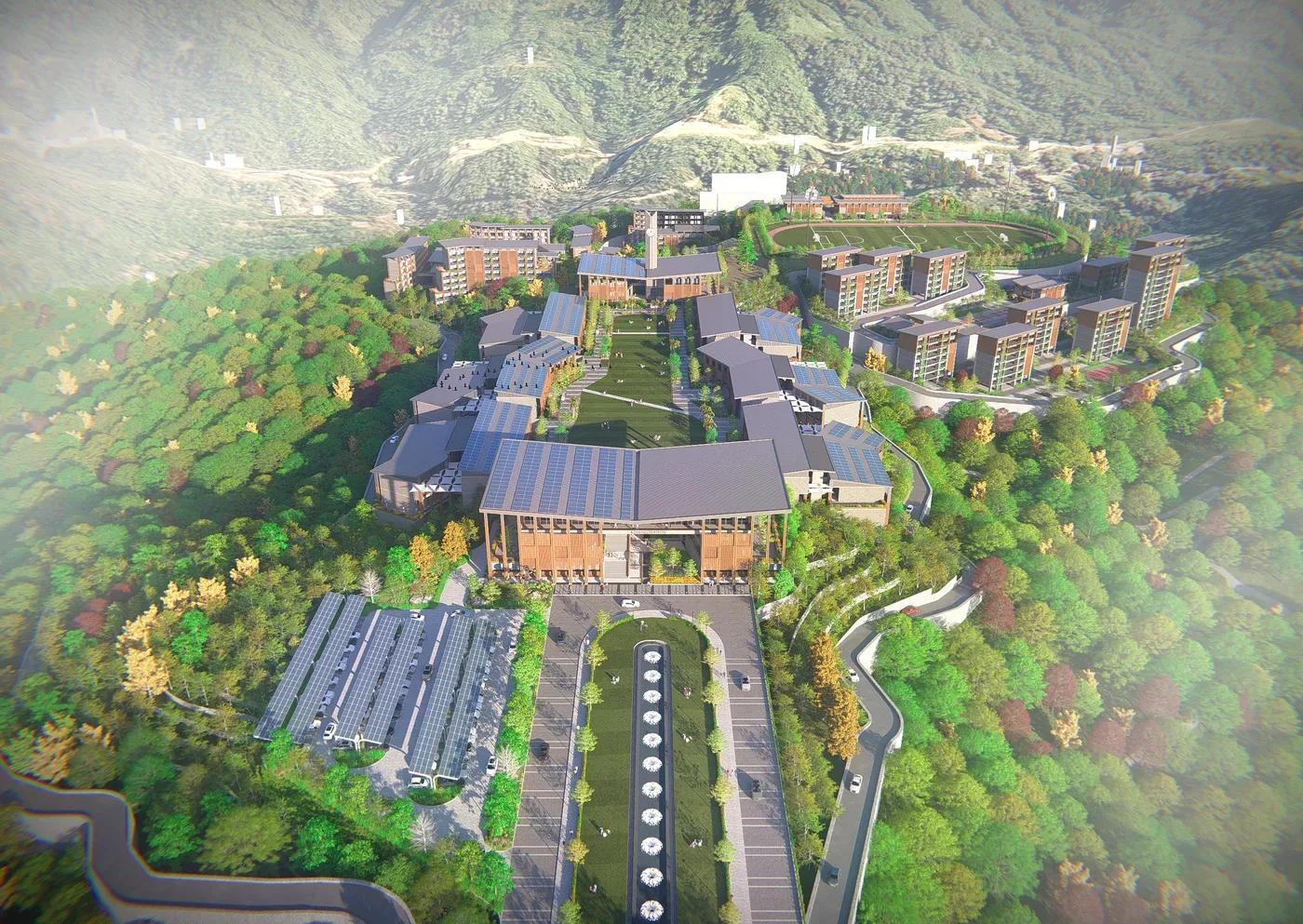 Golden-hour aerial view of the NIT Mizoram hillside campus nestled in forest terrain