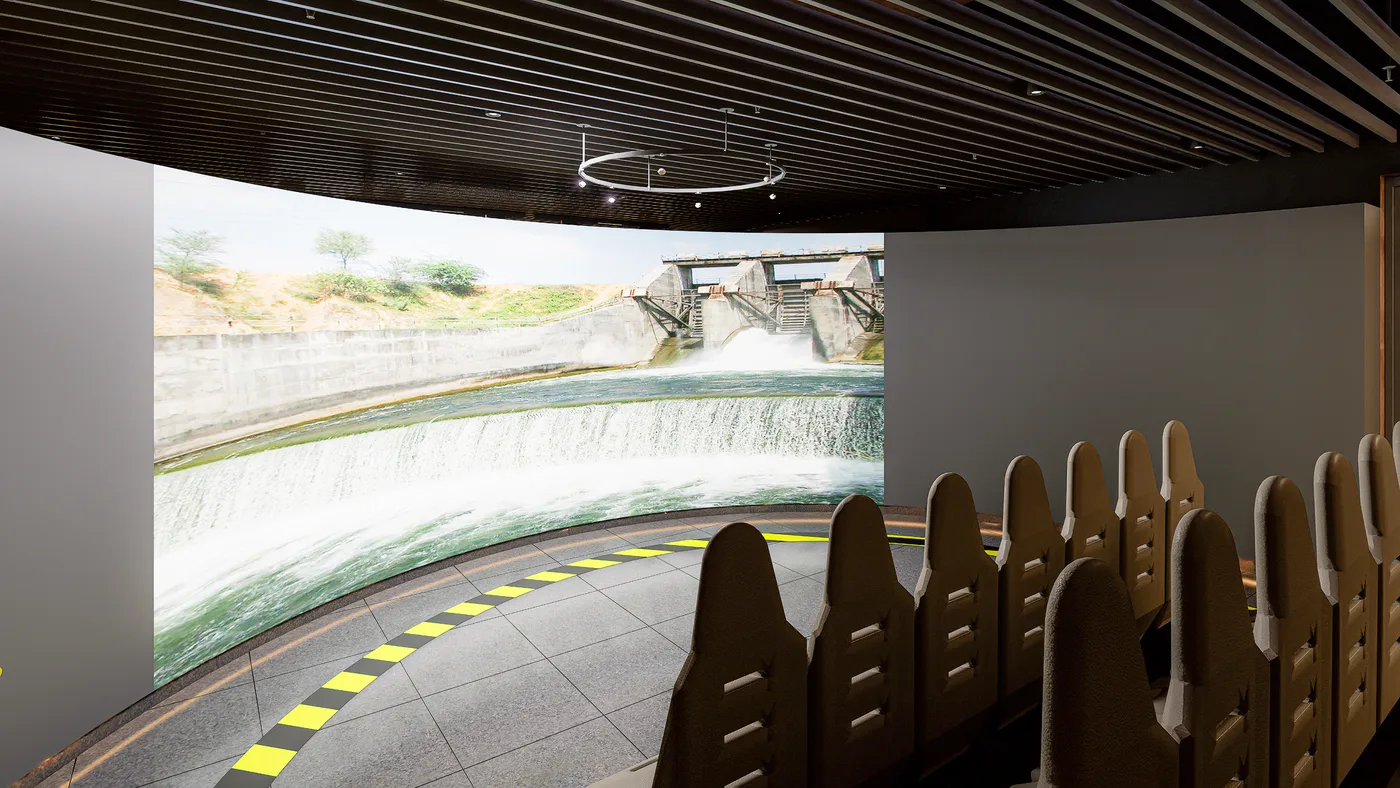 Immersive curved-screen theater inside a dam visitor experience centre